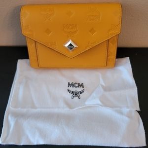 MCM LEATHER EMBOSSED TRIFOLD WALLET LIMITED MANGO COLOR